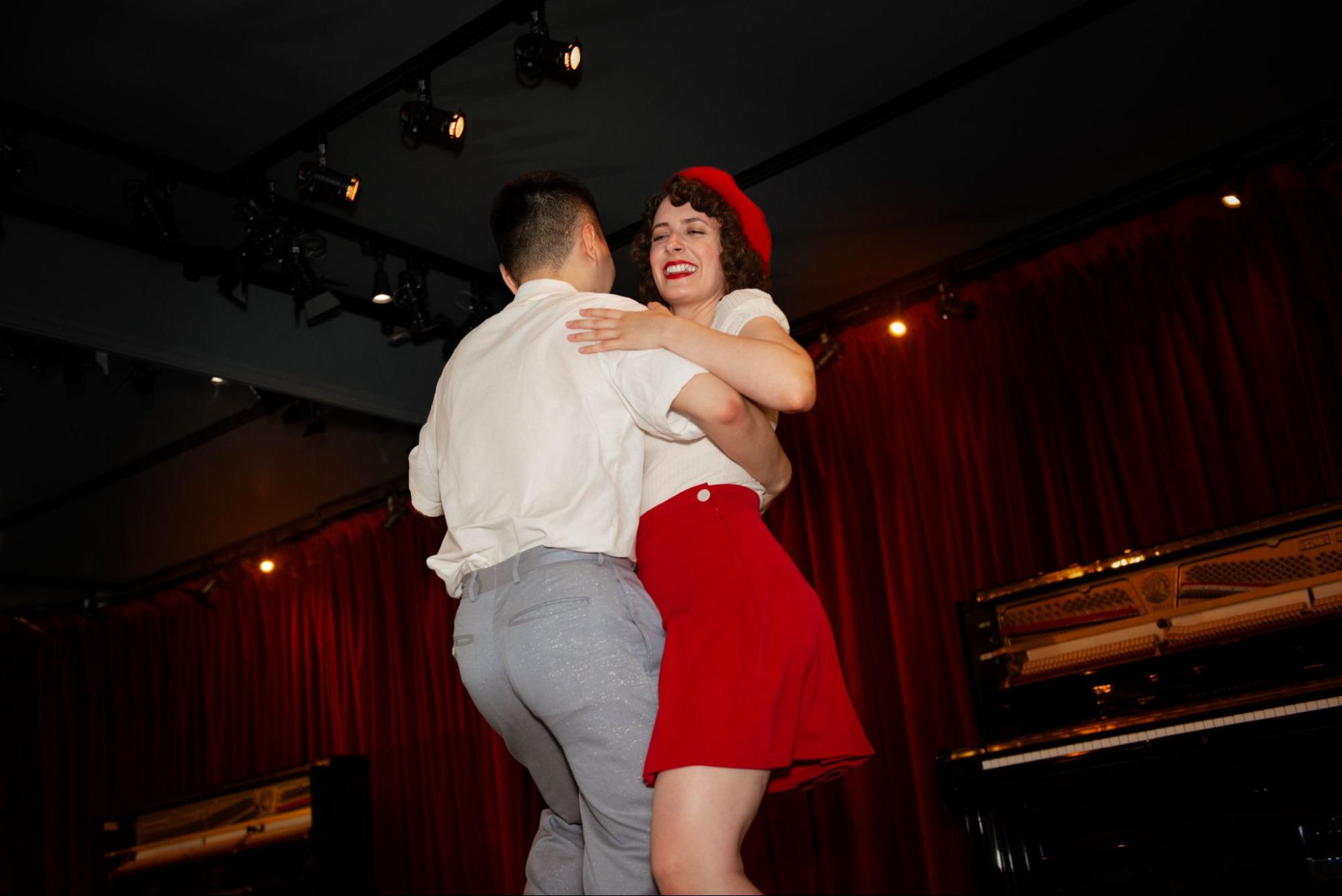 A couple enjoying Salsa dance lessons at RF Dance